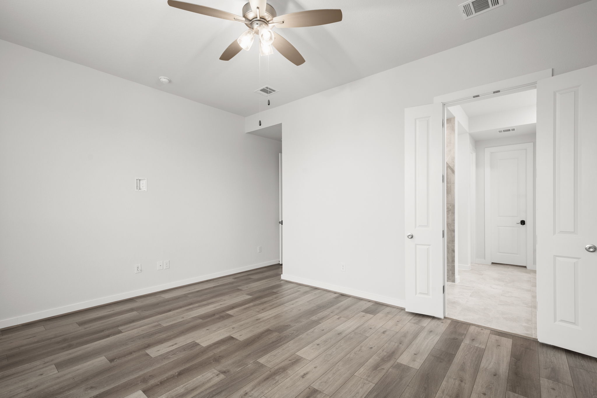 841 Spinnaker Loop Kyle, TX 78640 - Photo 25 of 40 Unfurnished room with light wood-type flooring and ceiling fan