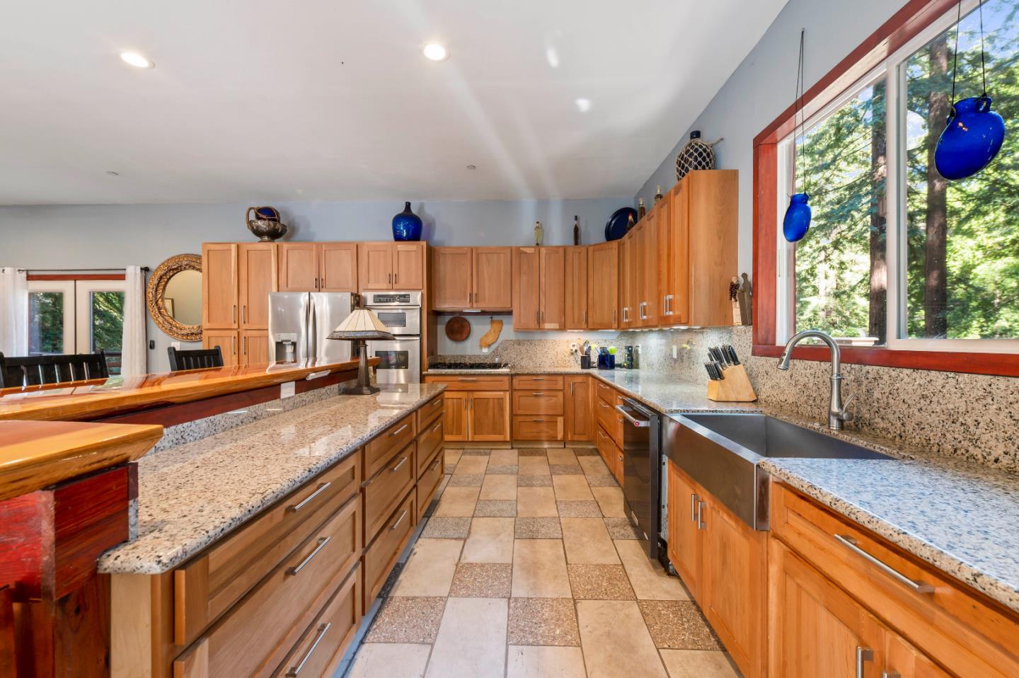 381 Hopkins Gulch Road Boulder Creek, CA 95006 - Photo 16 of 44 a large kitchen with stainless steel appliances granite countertop a sink and cabinets