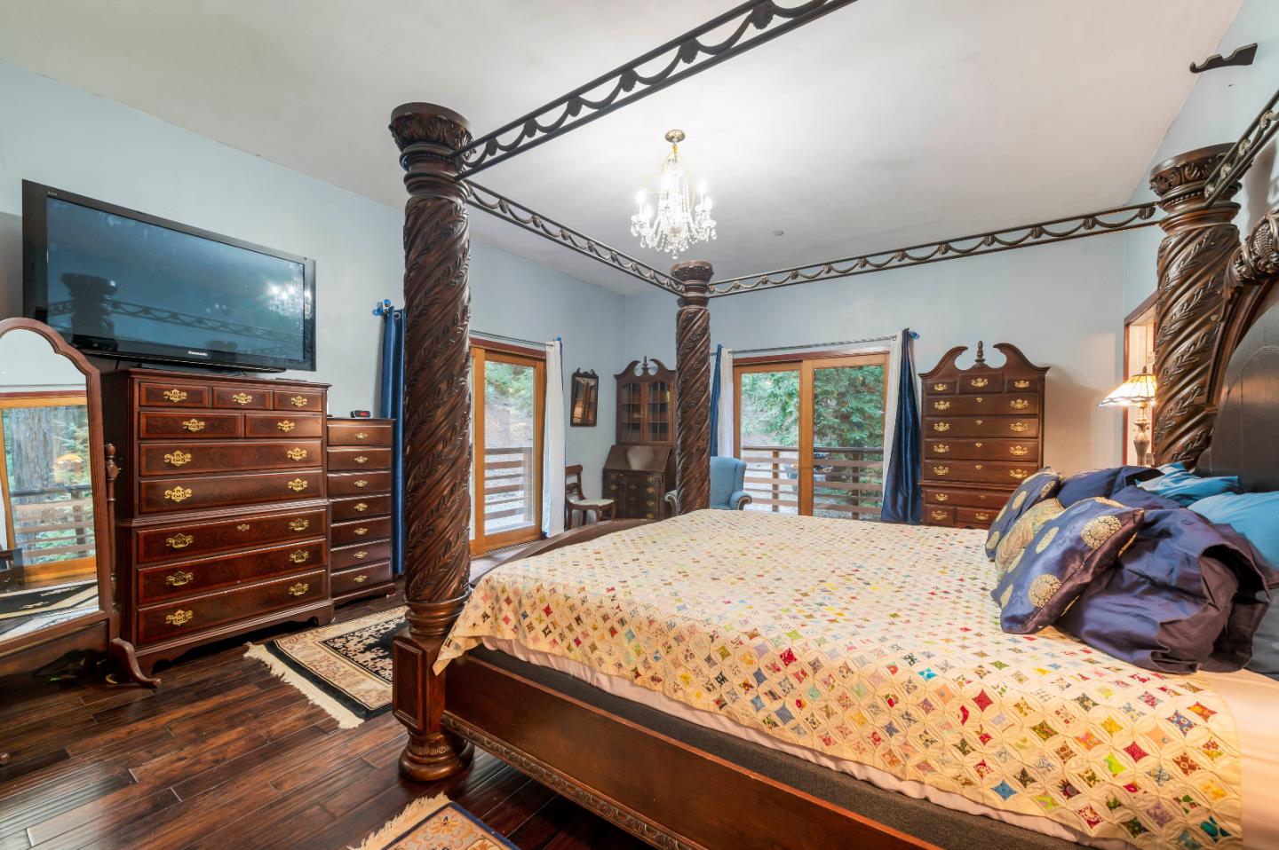 381 Hopkins Gulch Road Boulder Creek, CA 95006 - Photo 19 of 44 a bedroom with a bed and a flat screen tv