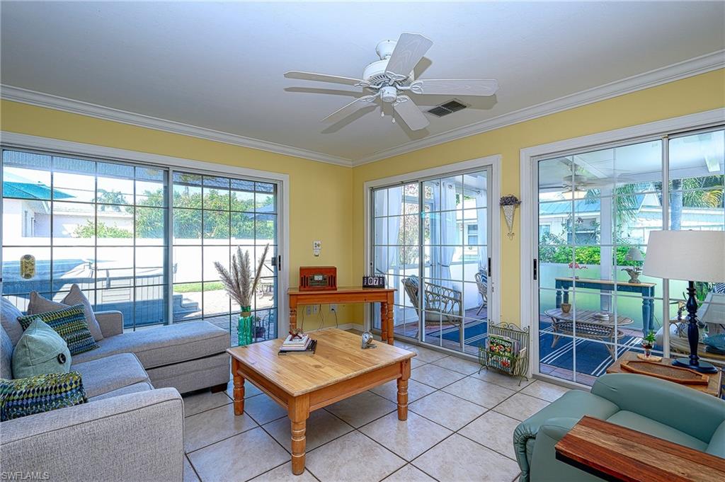 1247 Royal Palm Drive Naples, FL 34103 - Photo 11 of 28 a living room with furniture and a large window