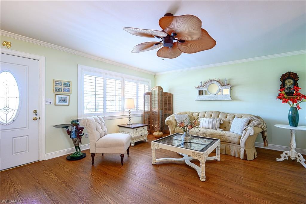 1247 Royal Palm Drive Naples, FL 34103 - Photo 15 of 28 a living room with furniture and a wooden floor