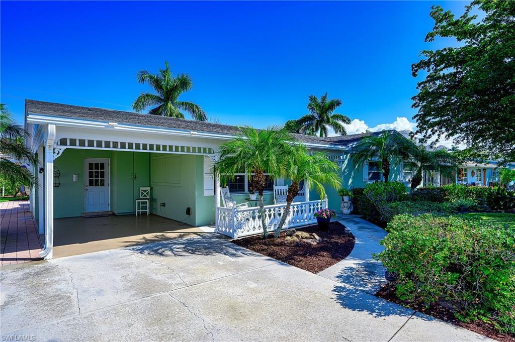 1247 Royal Palm Drive Naples, FL 34103 - Photo 4 of 28 a view of a house with a porch