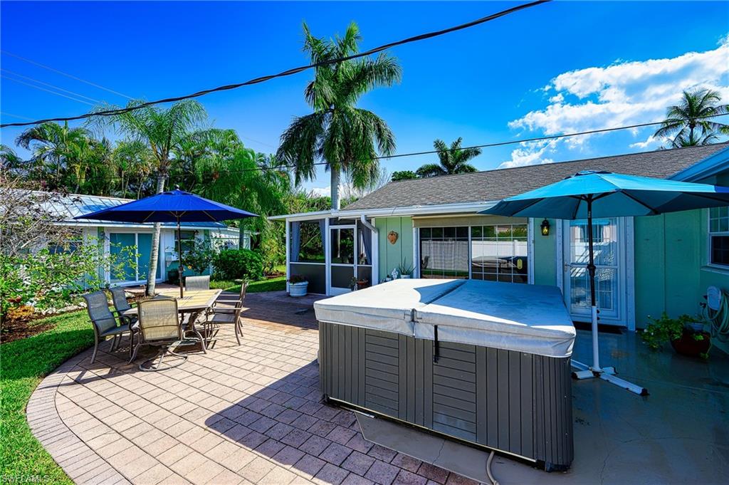 1247 Royal Palm Drive Naples, FL 34103 - Photo 7 of 28 a view of a house with swimming pool and sitting area