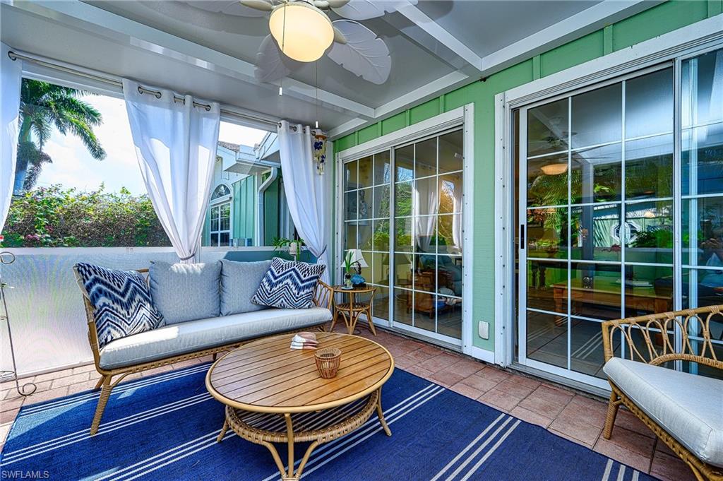 1247 Royal Palm Drive Naples, FL 34103 - Photo 9 of 28 a living room with furniture and a large window