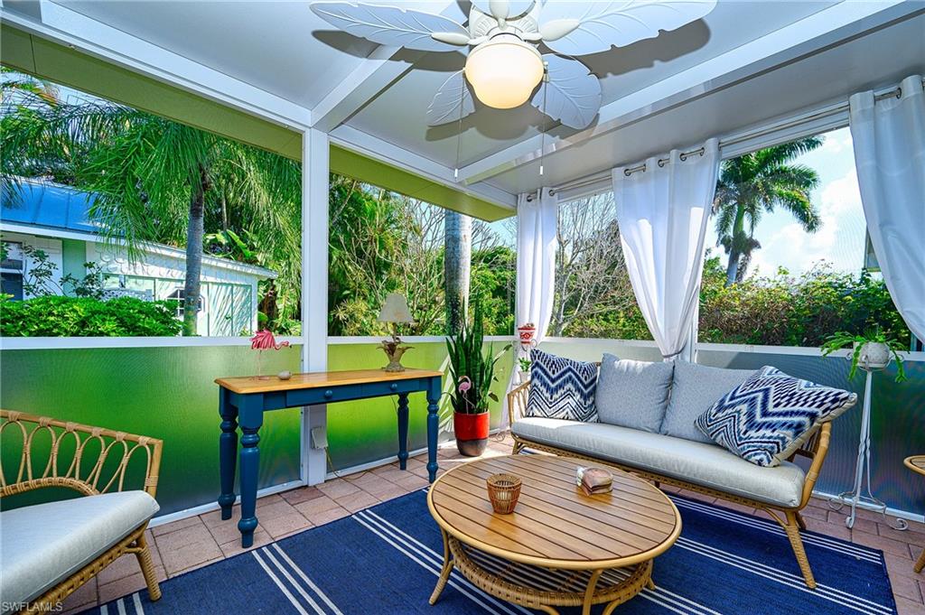 1247 Royal Palm Drive Naples, FL 34103 - Photo 10 of 28 a outdoor living space with furniture and a garden