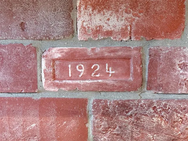 a view of a backyard with plants and patio