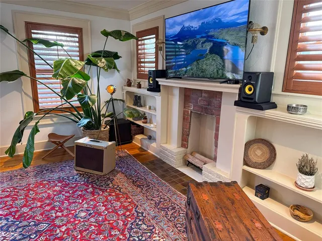a living room with furniture and a fireplace