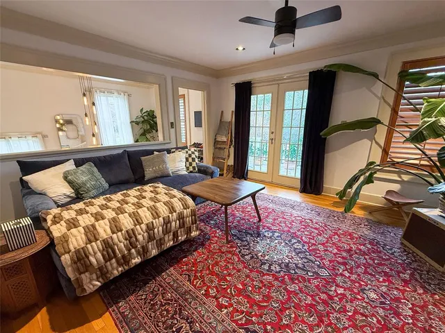 a living room with furniture and a rug