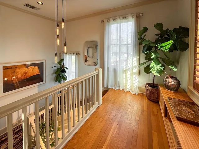 a room with wooden floor and furniture