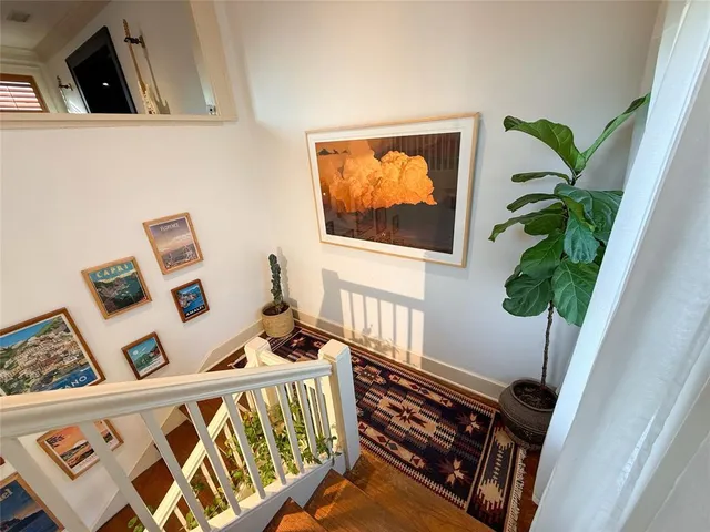 a bedroom with furniture and a potted plant