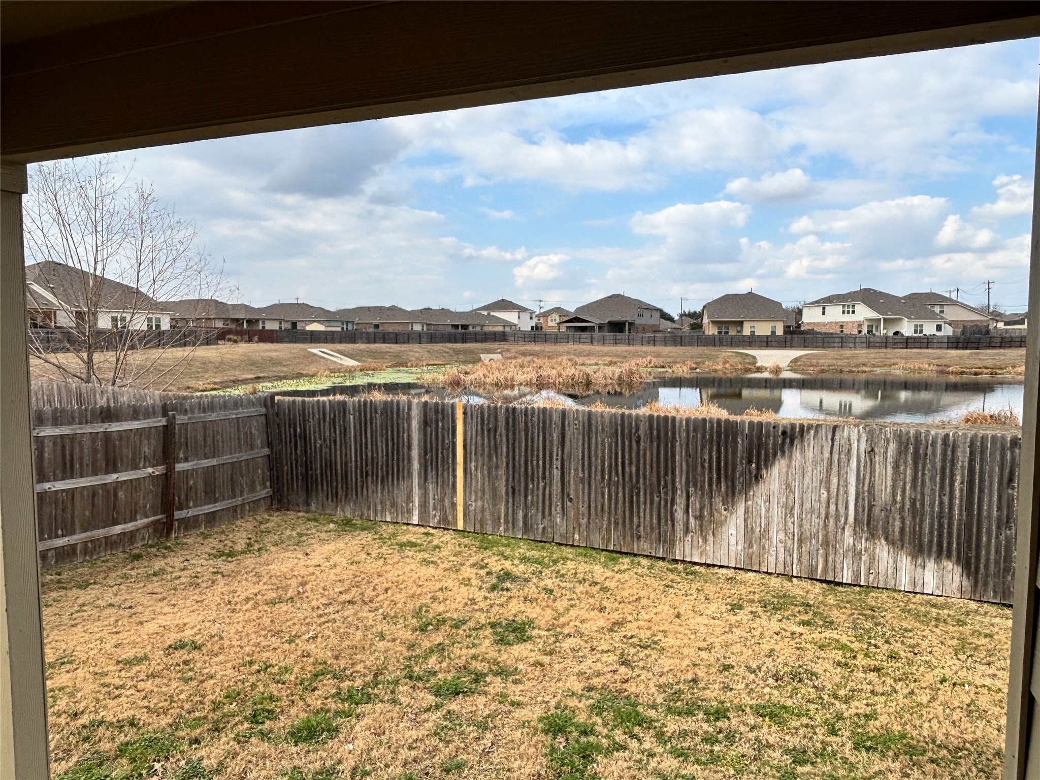 128 Calomel Trail Buda, TX 78610 - Photo 21 of 22 Fenced backyard featuring a residential view