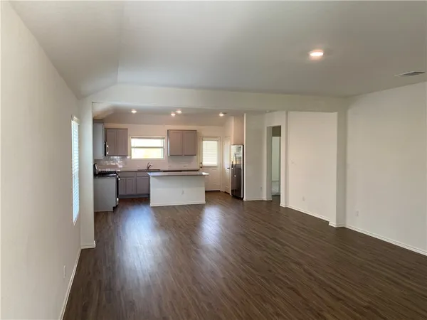 a view of kitchen with wooden floor