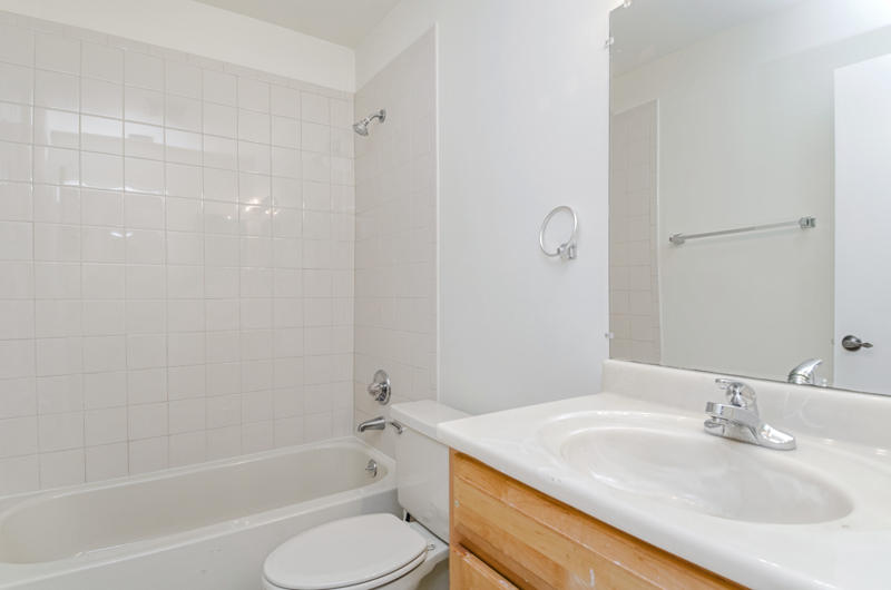 363 West Camino Real, Unit 4 Boca Raton, FL 33432 - Photo 24 of 37 a bathroom with a granite countertop sink toilet and shower