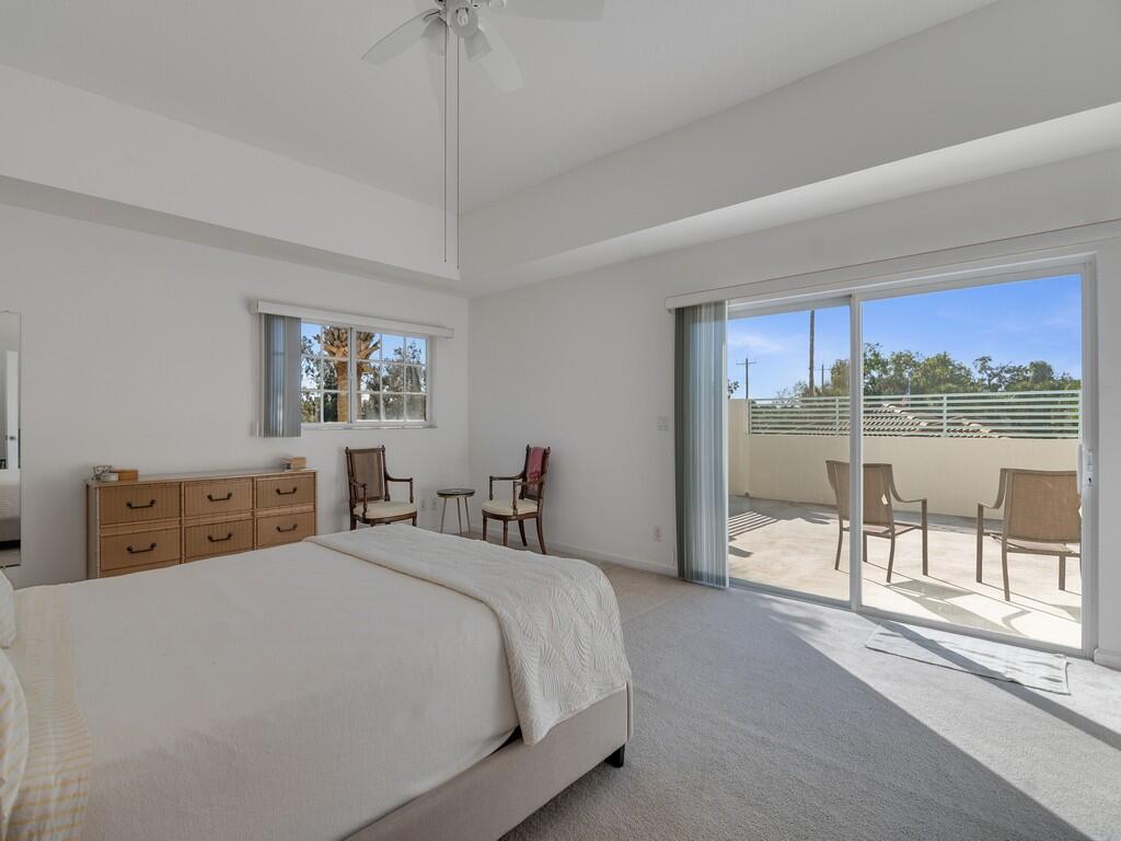 520 7th Square Southwest, Unit 201 Vero Beach, FL 32962 - Photo 12 of 46 a bedroom with a bed and a large window