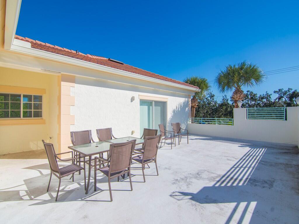 520 7th Square Southwest, Unit 201 Vero Beach, FL 32962 - Photo 19 of 46 a view of a house with backyard and sitting area