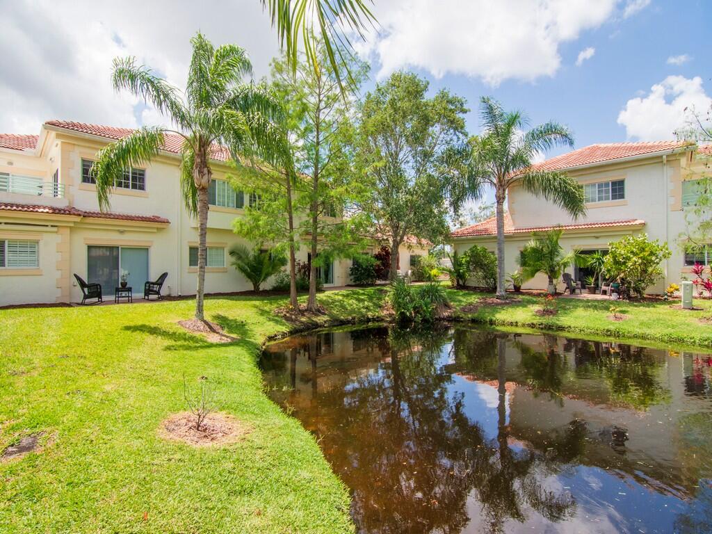520 7th Square Southwest, Unit 201 Vero Beach, FL 32962 - Photo 25 of 46 a view of swimming pool with outdoor seating and lake view