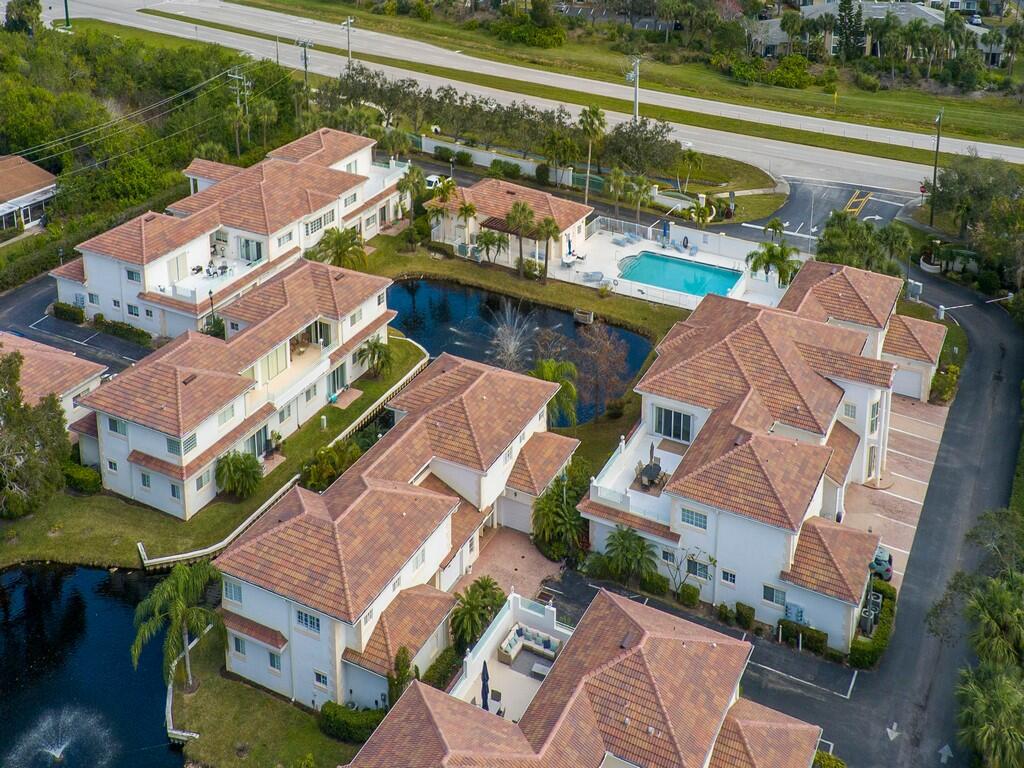 520 7th Square Southwest, Unit 201 Vero Beach, FL 32962 - Photo 29 of 46 an aerial view of a house with a lake view