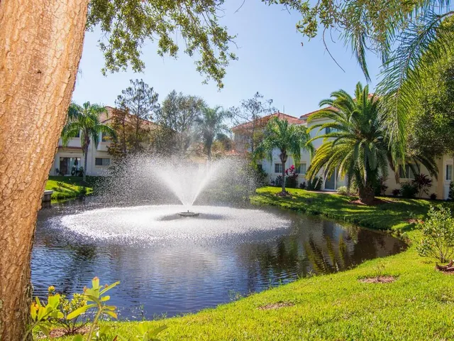 a view of a water fountain in a backyard