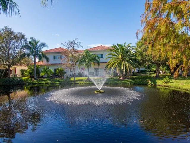 a view of a lake with a house in the background