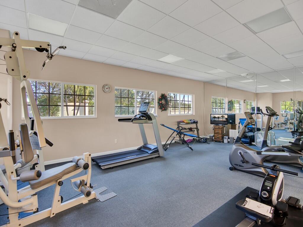 520 7th Square Southwest, Unit 201 Vero Beach, FL 32962 - Photo 33 of 46 a room with gym equipment and a large window