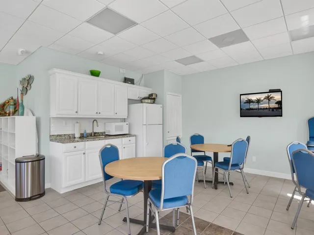 a view of kitchen with cabinets and wooden floor