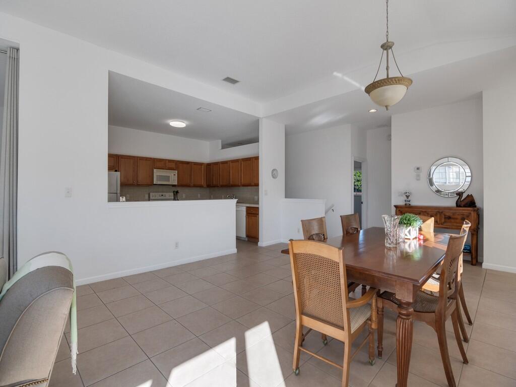 520 7th Square Southwest, Unit 201 Vero Beach, FL 32962 - Photo 5 of 46 a view of a dining room with furniture