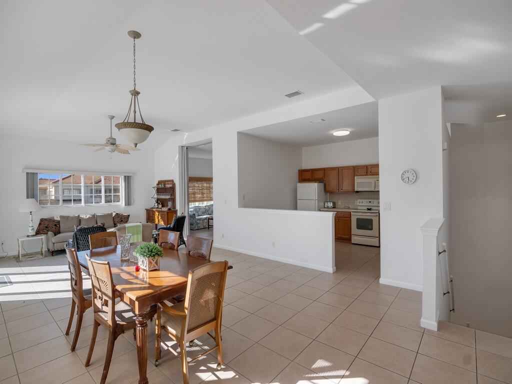 520 7th Square Southwest, Unit 201 Vero Beach, FL 32962 - Photo 9 of 46 a view of a dining room with furniture