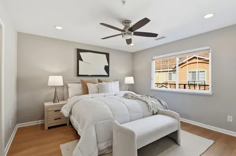 a bedroom with a bed and window