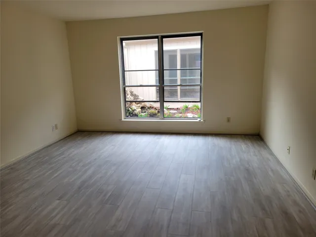 a spacious bathroom with double vanity sink and a mirror