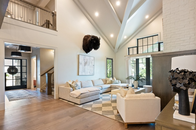 3 Carriagewood Cove, Unit 1088 Sandy, UT 84092 - Photo 15 of 79 Spacious living area featuring a vaulted ceiling with exposed beams, recessed lighting, and wood-finish flooring
