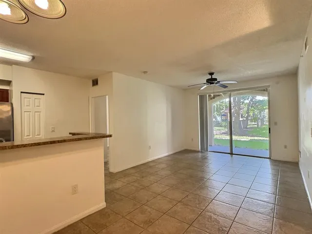 a view of a kitchen with a sink and dishwasher