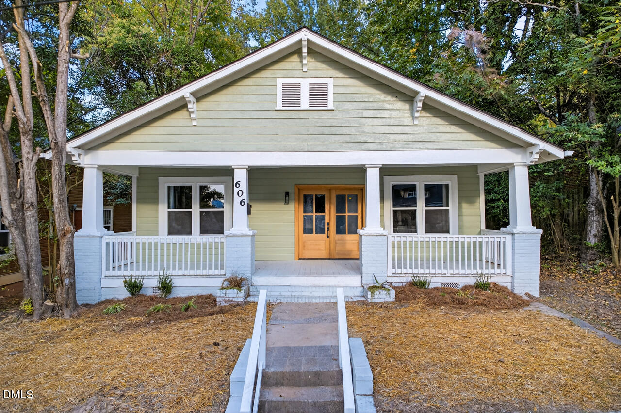 a front view of a house with a porch