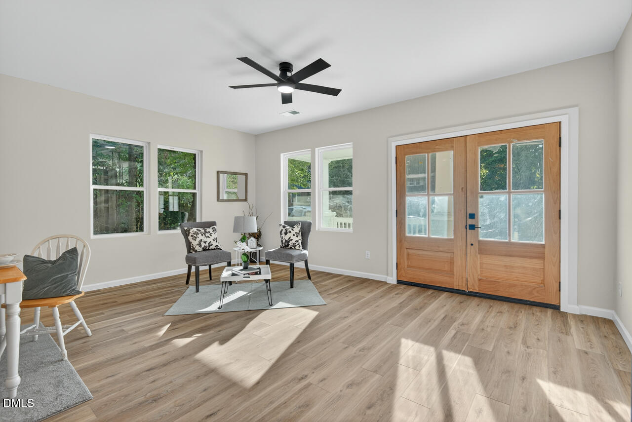 606 North Maple Street Durham, NC 27703 - Photo 13 of 51 a dining room with wooden floor and a window