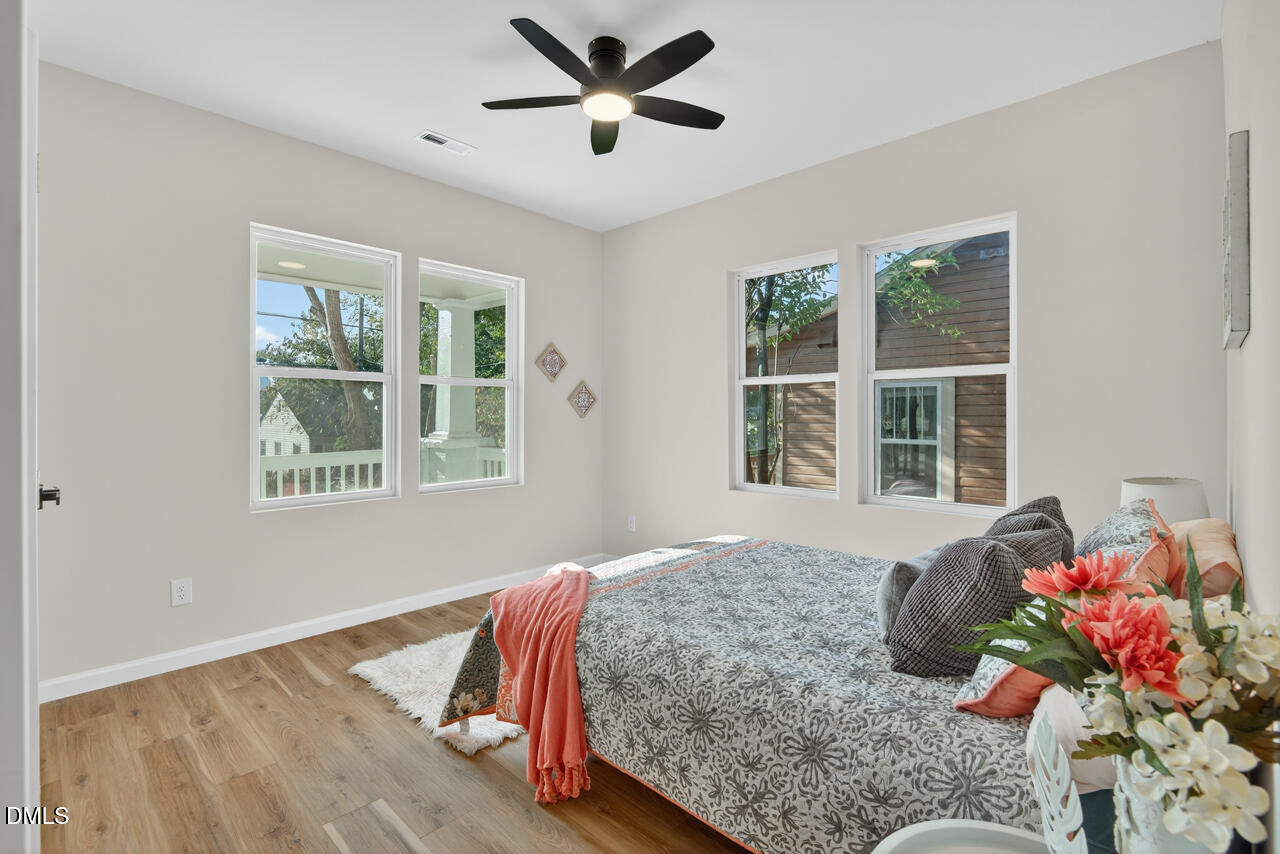 606 North Maple Street Durham, NC 27703 - Photo 24 of 51 a bedroom with a bed and window
