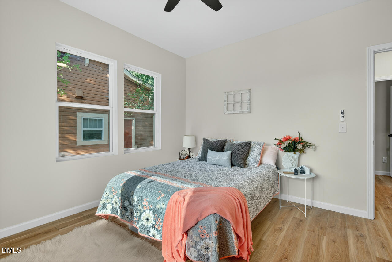 606 North Maple Street Durham, NC 27703 - Photo 25 of 51 a bedroom with a bed and a window