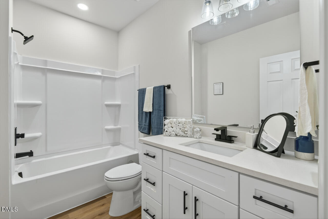 606 North Maple Street Durham, NC 27703 - Photo 26 of 51 a bathroom with a sink a toilet and a bathtub