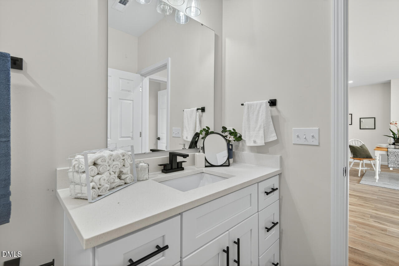 606 North Maple Street Durham, NC 27703 - Photo 28 of 51 a bathroom with a sink and a mirror