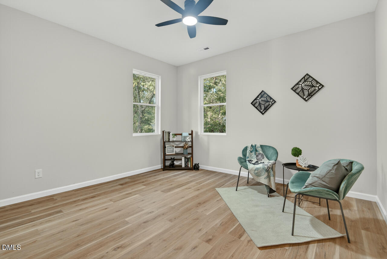 606 North Maple Street Durham, NC 27703 - Photo 30 of 51 a dining room with wooden floor and a window