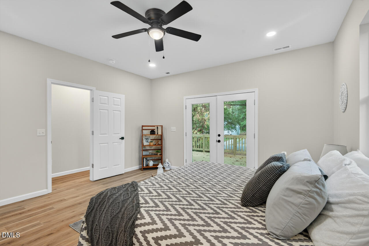 606 North Maple Street Durham, NC 27703 - Photo 34 of 51 a bedroom with a large bed and a large window