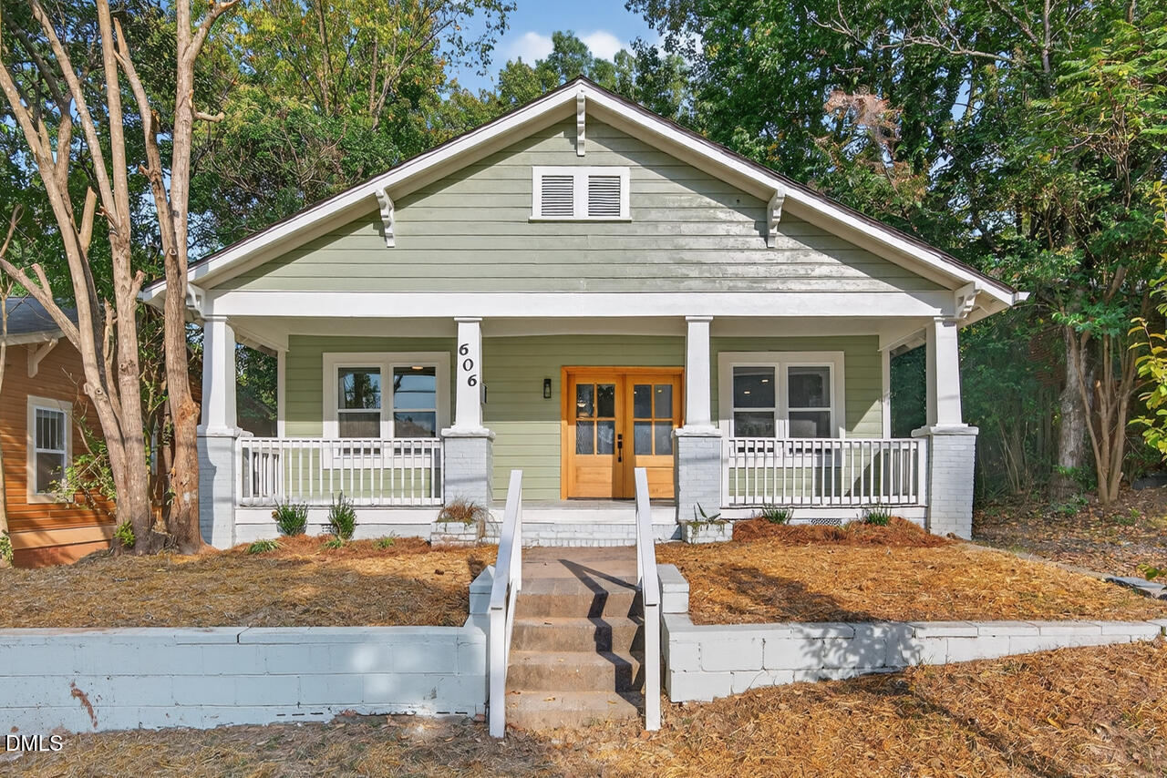 606 North Maple Street Durham, NC 27703 - Photo 49 of 51 a view of a house with backyard and chairs