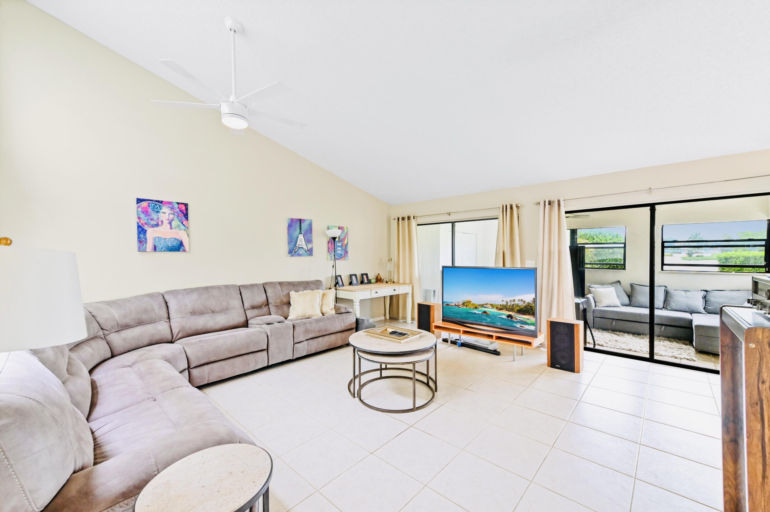 2749 Southwest 5th Street Delray Beach, FL 33445 - Photo 16 of 55 a living room with furniture and a flat screen tv