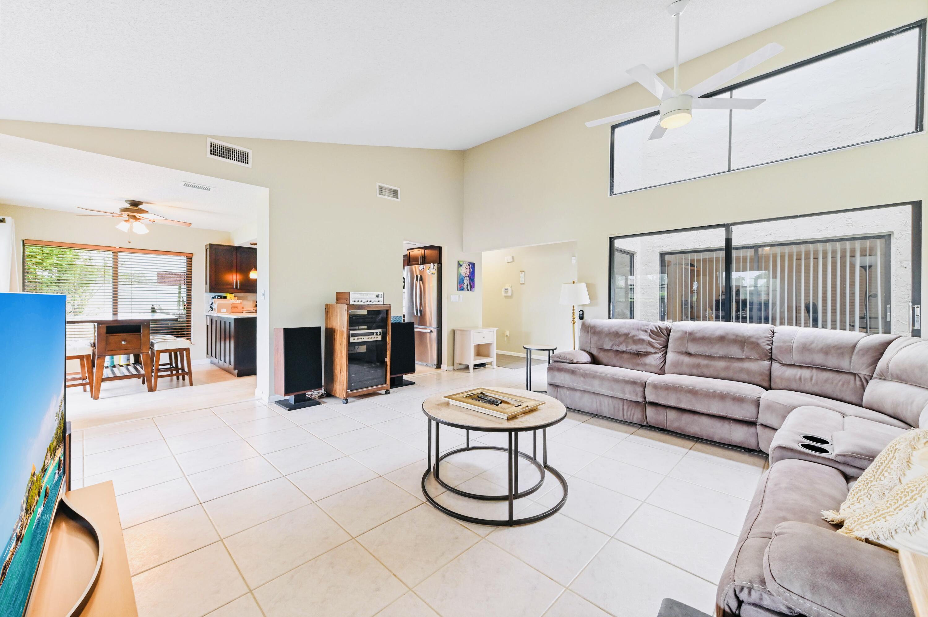 2749 Southwest 5th Street Delray Beach, FL 33445 - Photo 18 of 55 a living room with furniture kitchen view and a table