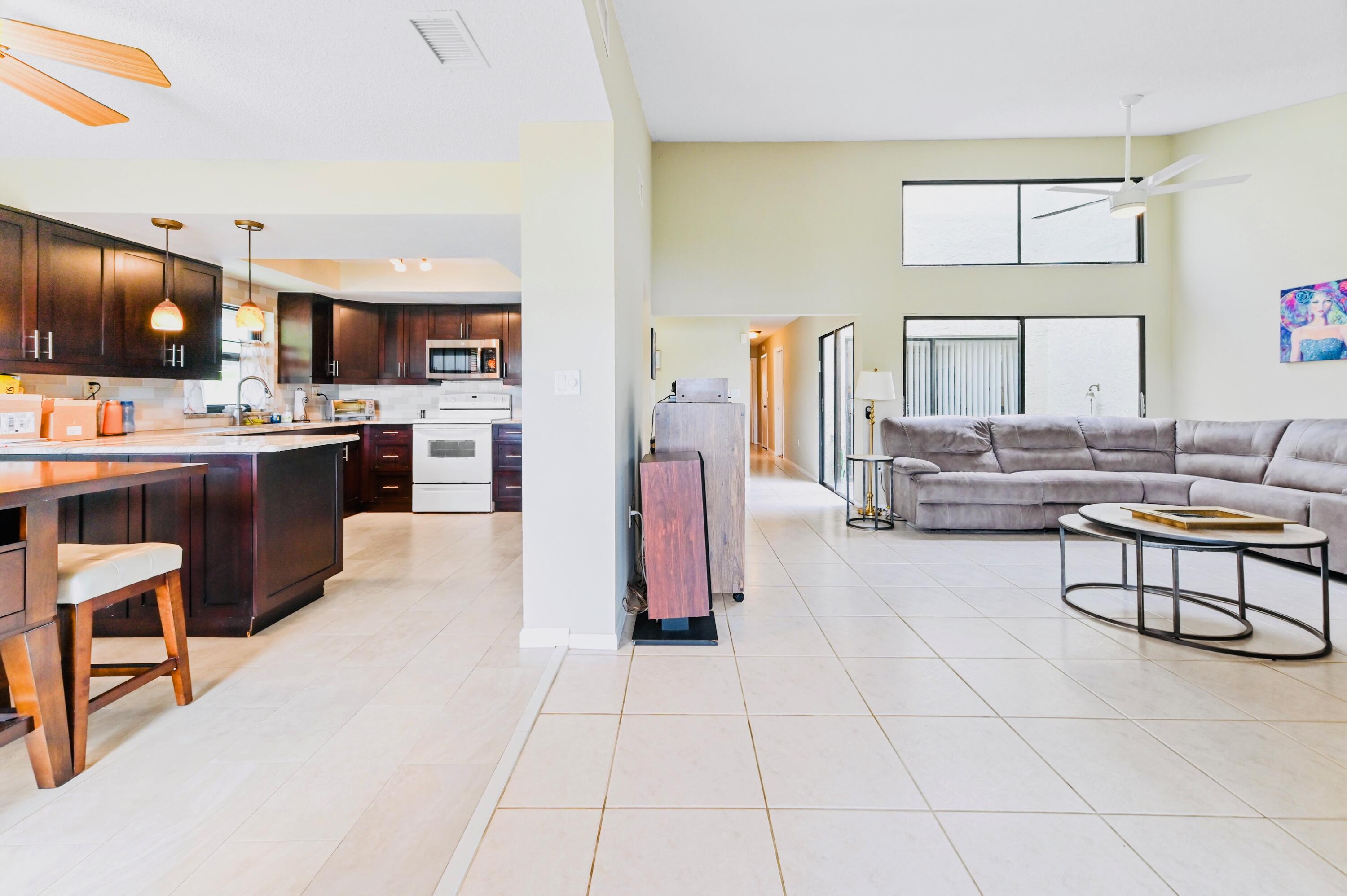 2749 Southwest 5th Street Delray Beach, FL 33445 - Photo 25 of 55 a living room with stainless steel appliances furniture and a kitchen view