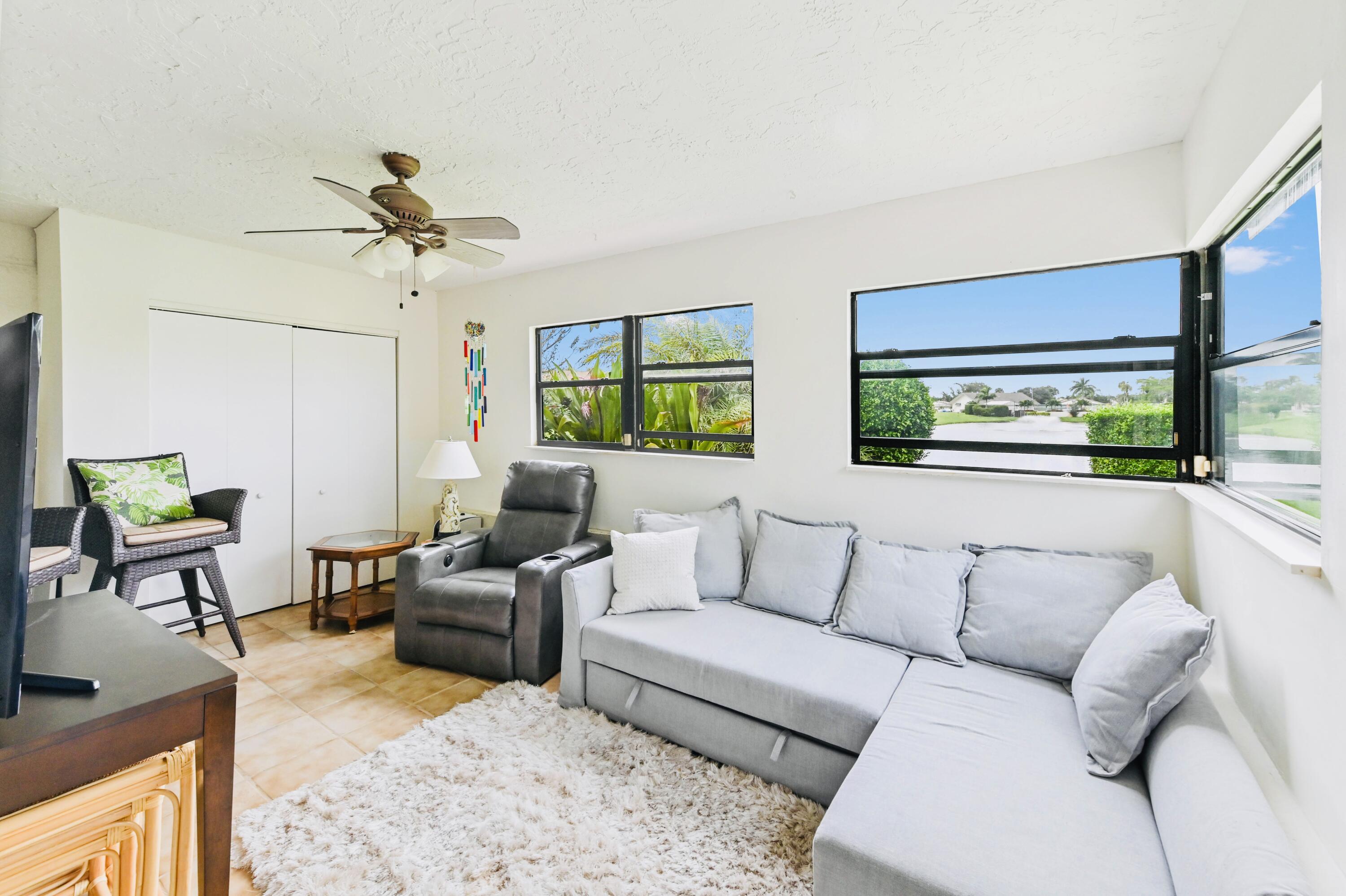2749 Southwest 5th Street Delray Beach, FL 33445 - Photo 26 of 55 a living room with furniture and a large window