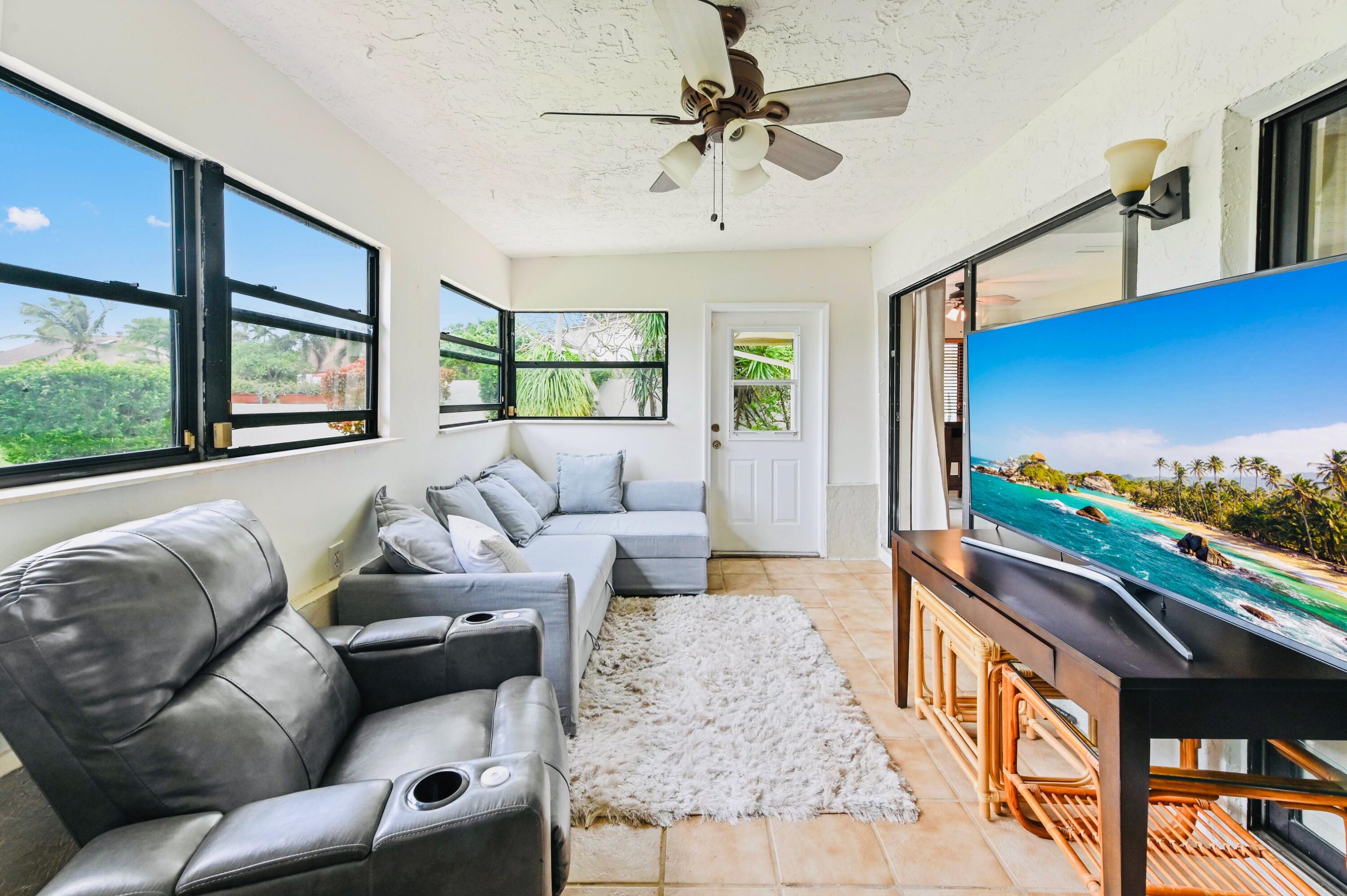 2749 Southwest 5th Street Delray Beach, FL 33445 - Photo 27 of 55 a living room with furniture and a flat screen tv