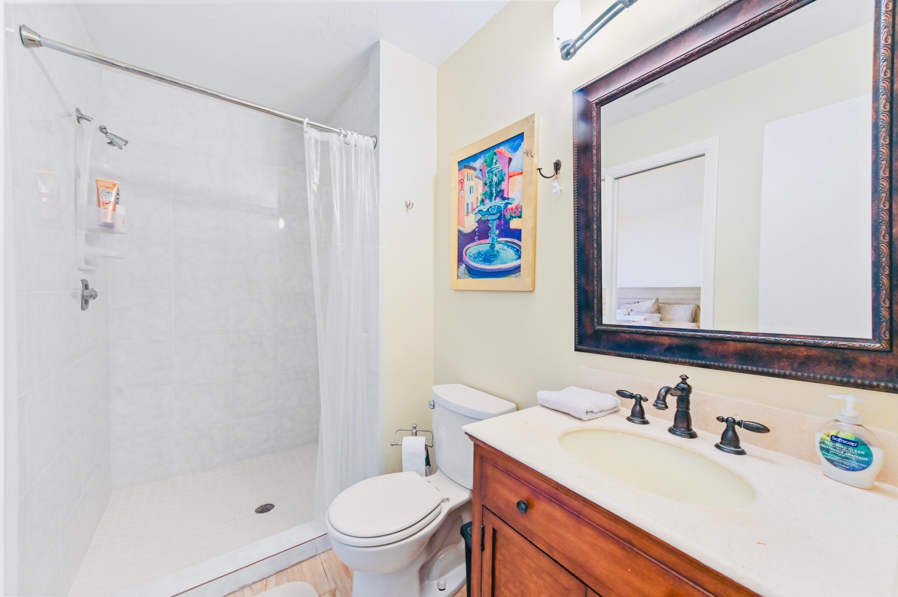 2749 Southwest 5th Street Delray Beach, FL 33445 - Photo 34 of 55 a bathroom with a sink a toilet and shower