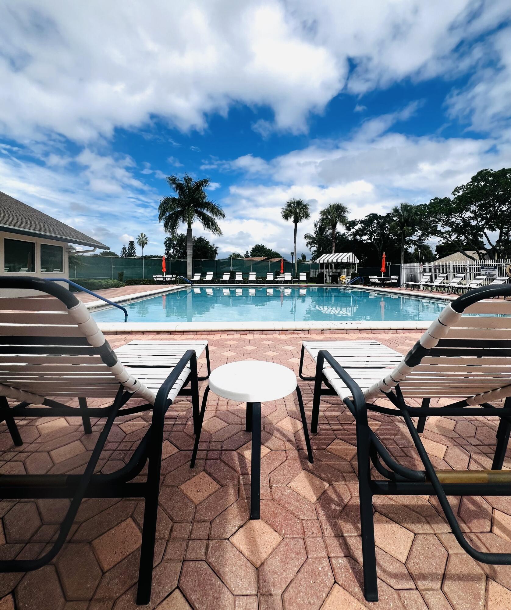 2749 Southwest 5th Street Delray Beach, FL 33445 - Photo 46 of 55 a view of a chairs and table in patio