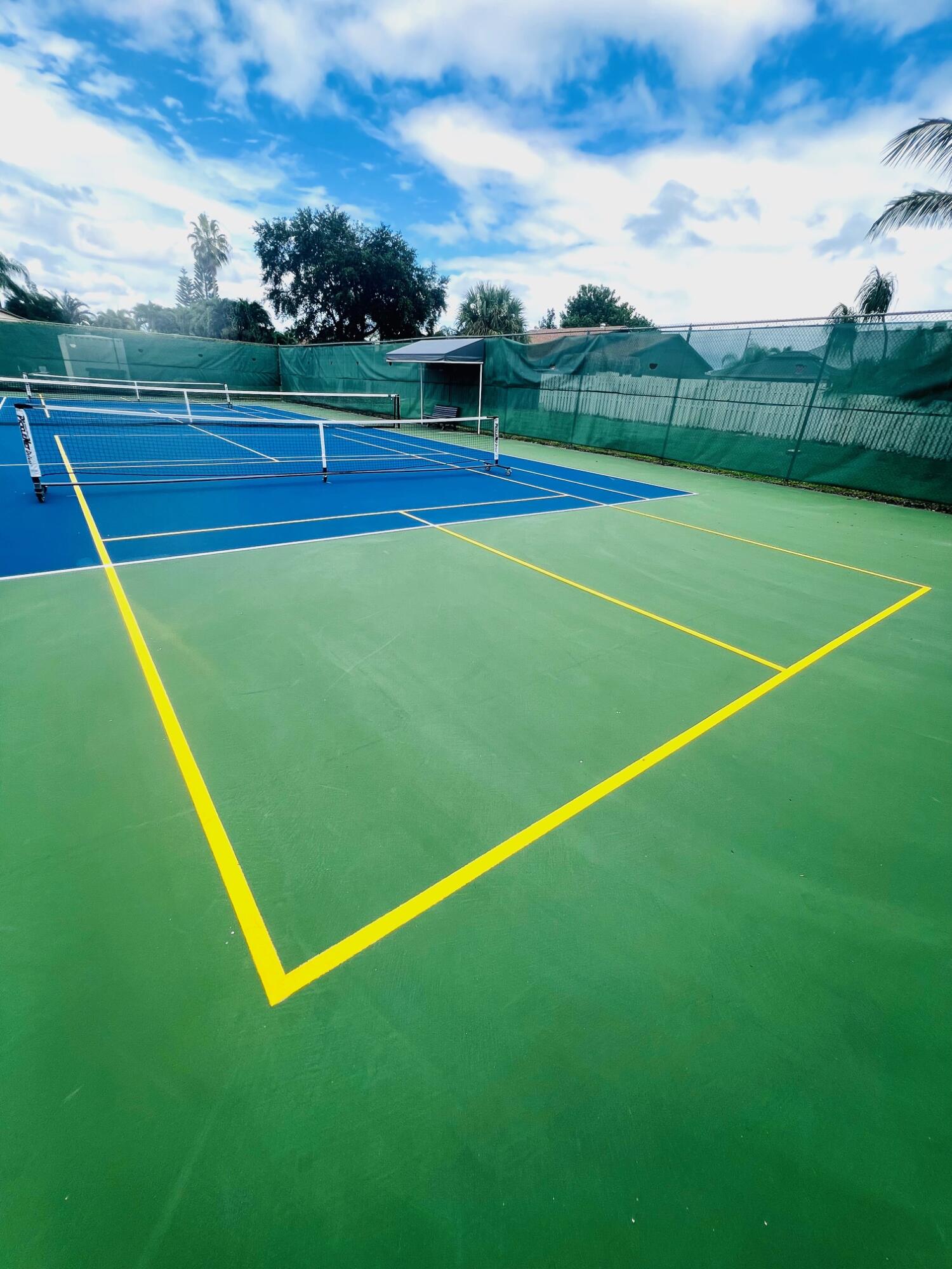 2749 Southwest 5th Street Delray Beach, FL 33445 - Photo 48 of 55 a view of an outdoor space and tennis court