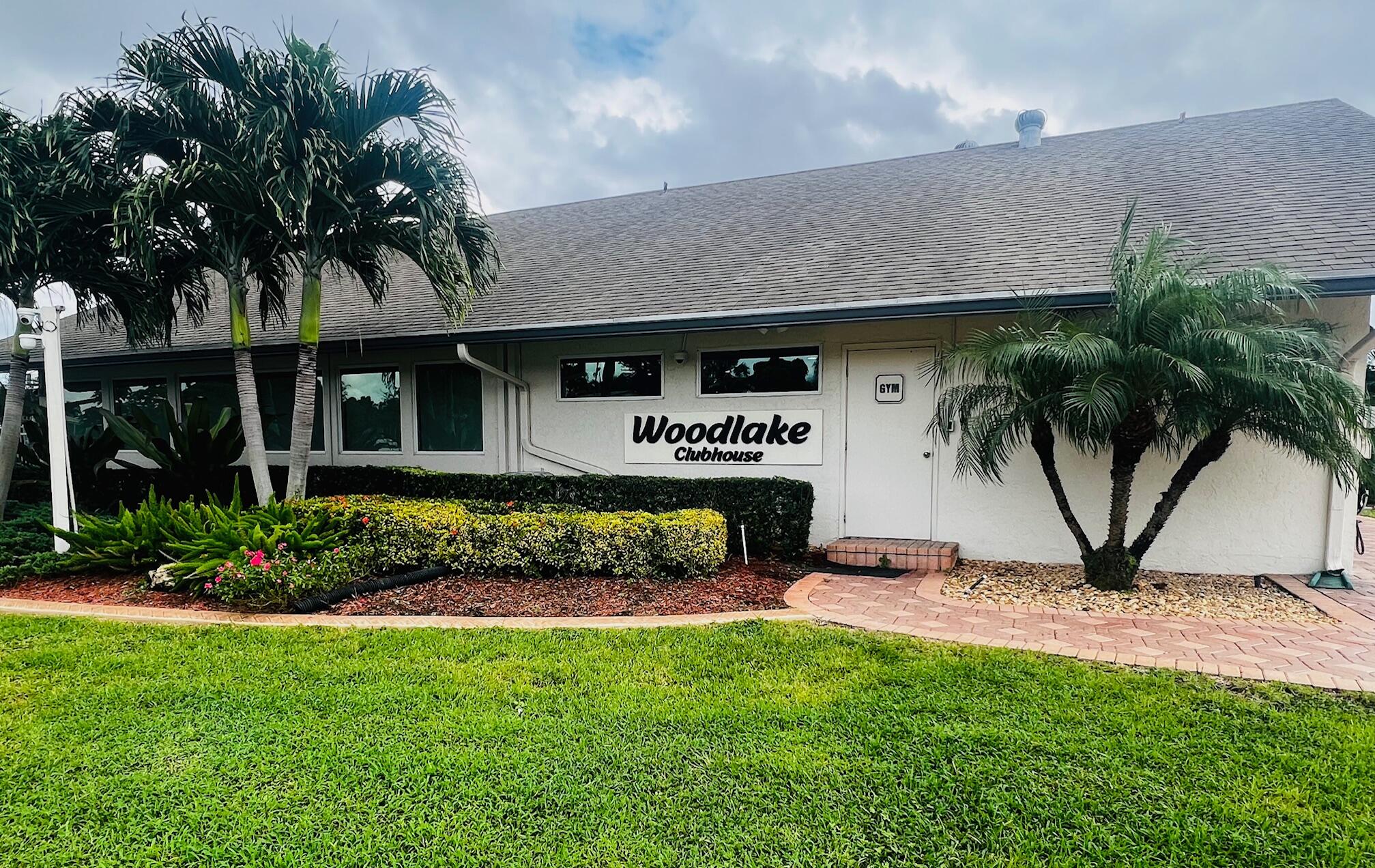 2749 Southwest 5th Street Delray Beach, FL 33445 - Photo 51 of 55 a front view of a house with garden