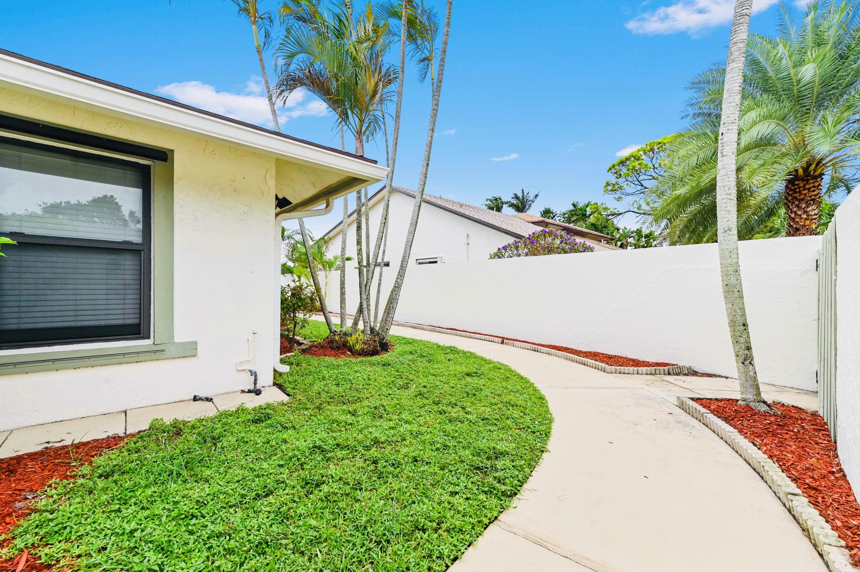 2749 Southwest 5th Street Delray Beach, FL 33445 - Photo 8 of 55 a view of a backyard with pathway